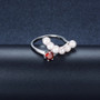freshwater pearl and garnet rhodium over sterling silver modern ring shown in a lifestyle photo