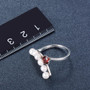 freshwater pearl and garnet rhodium over sterling silver modern ring shown for size comparison
