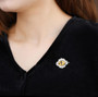 citrine vintage inspired rhodium over sterling silver brooch shown being worn