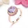round rose de france amethyst and white zircon halo ring in 18k rose gold over sterling silver shown in a lifestyle photo