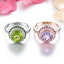 close up of round rose de france amethyst and white zircon halo ring in 18k rose gold over sterling silver