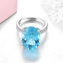 front view of swiss blue topaz and white zircon ring in rhodium over sterling silver
