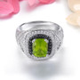front view of peridot black spinel and white zircon ring in rhodium over sterling silver