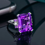 amethyst and emerald cut and diamond ring in 14k white gold shown in a lifestyle photo