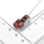 hessonite red cabochon garnet and zircon sugar loaf pendant necklace in rhodium over sterling silver shown for size comparison