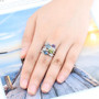 amethyst peridot blue topaz and zircon openwork ring in rhodium over sterling silver worn on a hand