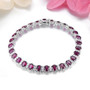 rhodolite garnet and white zircon tennis bracelet in rhodium over sterling silver shown in a lifestyle photo