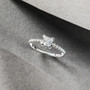 close up of moissanite princess cut wedding ring in rhodium over sterling silver