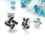 black spinel knot earrings in black and white rhodium over sterling silver shown in a lifestyle photo