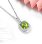 close up of peridot cushion and white zircon halo pendant necklace in rhodium over sterling silver