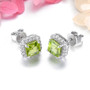 side view of square cut peridot and white zircon halo stud earrings in rhodium over sterling silver