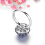 back view of tanzanite round cluster ring in black and white rhodium over sterling silver