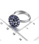 tanzanite round cluster ring in black and white rhodium over sterling silver shown for size comparison
