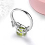 full view of peridot and white zircon leaf motif ring in rhodium over sterling silver