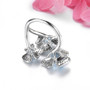 back view of sky blue topaz openwork flower ring in rhodium over sterling silver