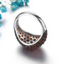 back view of domed garnet band ring in black and white rhodium over sterling silver