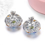 back view of peridot swiss blue topaz tanzanite citrine and zircon cluster stud earrings in rhodium over sterling silver