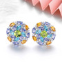 peridot swiss blue topaz tanzanite citrine and zircon cluster stud earrings in rhodium over sterling silver shown in a lifestyle photo