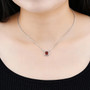 hessonite garnet and white zircon station necklace in rhodium over sterling silver worn around the neck