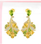 peridot citrine and zircon leaf earrings in 18k yellow gold over sterling silver shown in a lifestyle photo