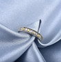 diamond band ring in 14k yellow and white gold shown in a lifestyle photo