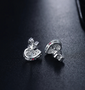 close up of diamond cluster pear stud earrings in 14k white gold