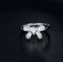 baguette diamond bow ring in 14k white gold shown in a lifestyle photo