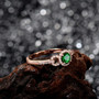 side view of tsavorite garnet and diamond ring in 18k rose gold