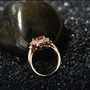 full view of regal pink tourmaline and diamond ring in 18k rose gold