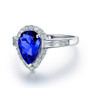 side view of tanzanite and diamond pear halo ring in 14k white gold