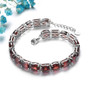 side view of garnet adjustable tennis bracelet in rhodium over sterling silver