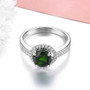 front view of chrome diopside and white zircon round halo ring in rhodium over sterling silver