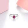 front view of unheated ruby and diamond oval halo 18k white gold ring