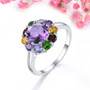 amethyst and multi gemstone halo ring in rhodium over sterling silver shown in a lifestyle photo
