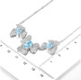 sky blue topaz and zircon flowering necklace in rhodium over sterling silver shown for size comparison