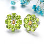peridot and citrine flower cluster stud earrings in rhodium over sterling silver shown in a lifestyle photo