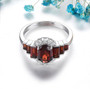front view of garnet and white zircon ring in rhodium over sterling silver