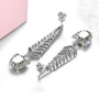 back view of designer peridot and zircon dangle earrings in rhodium over sterling silver