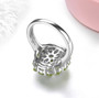 back view of peridot and white zircon halo ring in rhodium over sterling silver