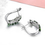 back view of chrome diopside and white zircon j-hoops in rhodium over sterling silver