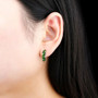 chrome diopside and white zircon j-hoops in rhodium over sterling silver shown being worn