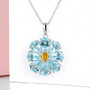 sky blue topaz and citrine necklace in rhodium over sterling silver shown in a lifestyle photo