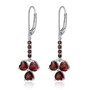 full view of sky blue topaz heart dangle earrings in rhodium over sterling silver