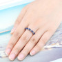 sapphire and white zircon band ring in rhodium over sterling silver worn on a hand