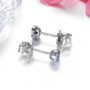 full view of bezel set 3 5mm round tanzanite stud earrings in 10k white gold
