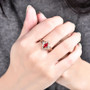 ruby and diamond ring in 18k rose gold worn on a hand