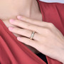 diamond eternity band ring in 14k yellow gold worn on a hand