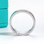 full view of modern moissanite mens wedding band ring in rhodium over sterling silver