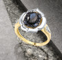 sapphire and diamond ring in 14k white and yellow gold shown in a lifestyle photo