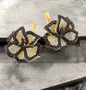 lab brown spinel and cubic zirconia flower earrings in 18k yellow gold over sterling silver shown in a lifestyle photo